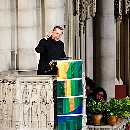 Portrait of Rev Pfleger speaking at Historic Riverside Church NYC 886px by 800px
